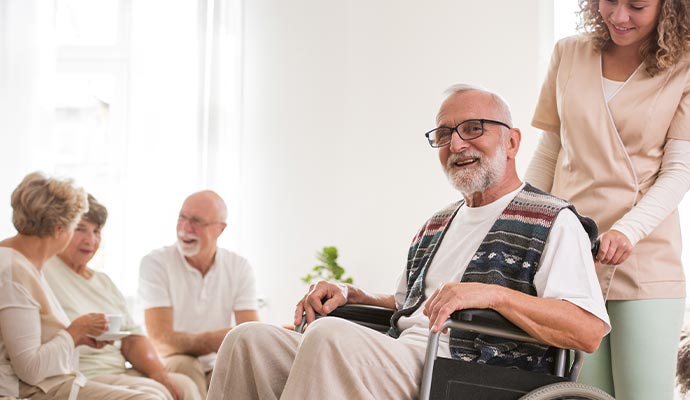 care-giver assisting senior resident with ambulation